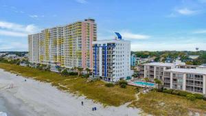 an aerial view of a resort with a beach and buildings at Oceanfront Condo, Steps to the Beach in Myrtle Beach