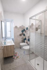 a bathroom with a toilet and a sink and a shower at Casa Vacanze RosMary in Agropoli +49 photos