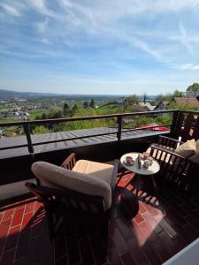 a balcony with chairs and a table with a view at The View in Sveta Nedjelja