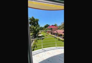 a view of the park from the balcony of a resort at North Queen Resort in Mal bazar
