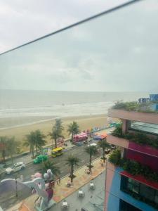 a view of a beach and a city with a building at Sweet Home in Gò Ba Quần