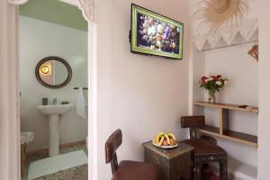 a bathroom with a toilet and a sink and a mirror at Riad Morocco Sky in Marrakesh +81 photos