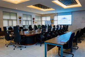 a conference room with a long table and chairs at Virunga Inn Resort & Spa in Kinigi