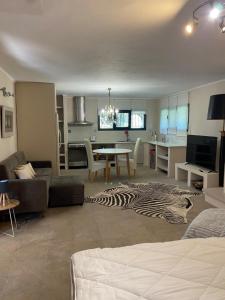 a living room with a zebra rug on the floor at Wave Rider Villa in Kouvéla