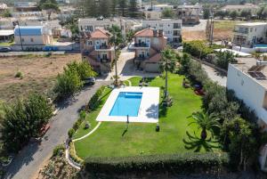 an aerial view of a yard with a swimming pool at Socrates Holidays Apt 3 with Pool near the Beach in Kamisianá