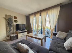 a living room with a couch and a table at Noax gite Durbuy in Durbuy