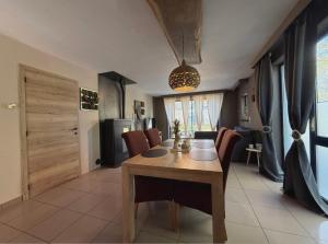 a kitchen and dining room with a table and chairs at Noax gite Durbuy in Durbuy +12 photos