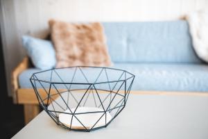 a glass bowl on a table in a living room at WAKE INN by Pidu-LA in Abula +23 photos