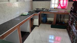 a kitchen with a sink and a counter top at Madu Guest in Nuwara Eliya +4 photos