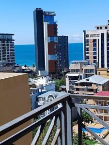 a view of a city with buildings and the ocean at ევრო პალას გონიო in Kvariati