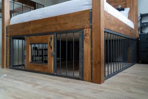 a large wooden fence with a door in a building at LV8 Chesterfield in Chesterfield