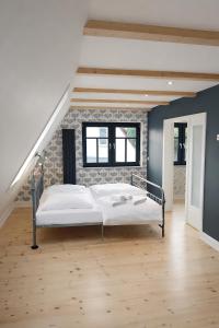 a bedroom with a bed and a brick wall at Ferienhaus in Graal-Müritz in Graal-Müritz