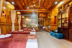 a large room with two beds in it at Family Private Villa Hội An in Hoi An +25 photos