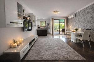 a living room with a couch and a dining room at Marica Apartment in Plovdiv