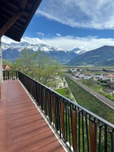 a balcony with a view of snow covered mountains at Fernblick in Sluderno