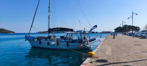 a sailboat is docked at a dock in the water at ARGO III Sailing Yacht in Skiathos