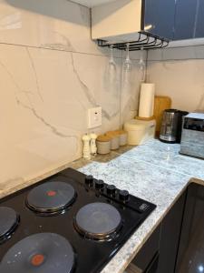 a kitchen with a black stove top in a kitchen at 3 on Eland in Vryheid +6 photos