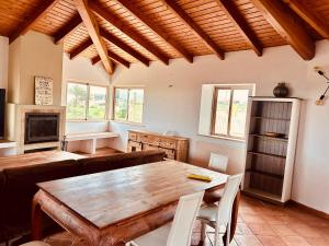 a living room with a wooden table and chairs at Moonshine Studios Lagos in Lagos