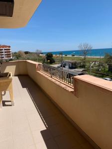 a balcony with a view of the ocean at Appartamento Fronte Mare Rosa 2 in Ardore Marina