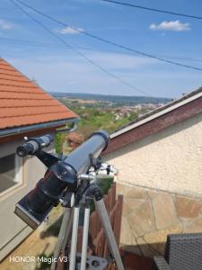 a camera on a tripod in front of a house at Lacrima del Mare in Zalaegerszeg +18 photos