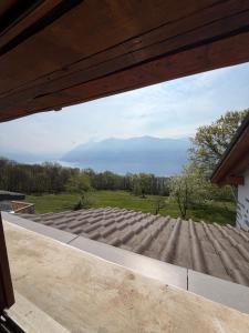 a view of a mountain from a window of a house at Rustico Corte in Brissago +9 photos
