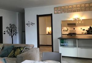 a living room with a couch and a kitchen at My house in Turin +7 photos