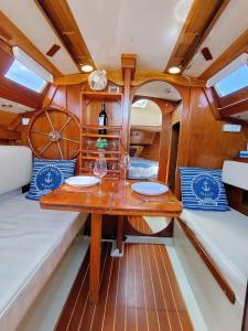 a wooden table in the middle of a boat at Miramare in Playa Blanca