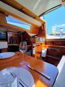 a wine glass sitting on a table in a boat at Miramare in Playa Blanca +2 photos