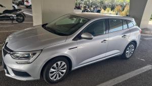 a silver car parked in a parking lot at Templum Iovis-Front of port in Civitavecchia