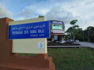 a sign that is in front of a building at 4 Seasons Homestay in Kuantan