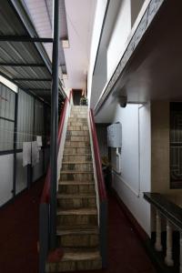 a stairway in a building with a stair case at Velankanni Home Stay in Mangalore