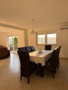 a dining room with a table and chairs at Villa Rest Ilijas 4 bedrooms in Ilijaš