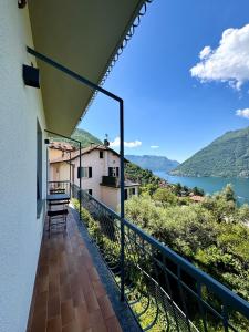 a balcony with a view of the water at Casa Mirit - Nesso in Nesso