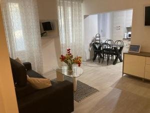 a living room with a couch and a table at La Terrazza di Como in Como