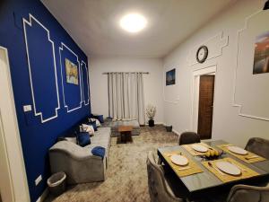 a living room with a couch and a table at Elite Apartment In Cairo Downtown in Cairo
