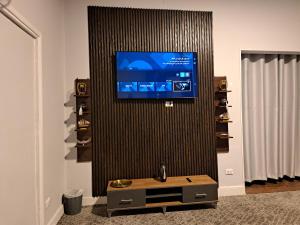 a flat screen tv on a wall in a living room at Elite Apartment In Cairo Downtown in Cairo