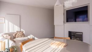 a living room with a glass table and a couch at Groenendijk 8 in Oostduinkerke