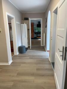 a hallway of a house with a door and wooden floors at Ferienhaus Mediterran in Bruttig-Fankel für 2-5 Personen in Bruttig-Fankel
