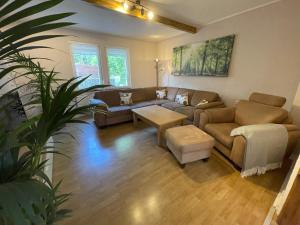 a living room with a couch and a table at Ferienhaus Mediterran in Bruttig-Fankel für 2-5 Personen in Bruttig-Fankel