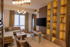 a living room with a couch and a table at Lux residence Adrijana 1 in Ulcinj