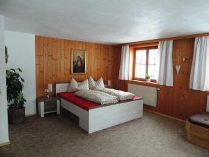 a bedroom with a bed and a window at Rüf Stefanie in Au im Bregenzerwald