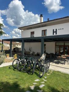a group of bikes parked in front of a building at Apartamentos COVARRUBIAS in Covarrubias