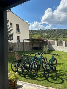 a row of bikes parked in a yard at Apartamentos COVARRUBIAS in Covarrubias +1 photo