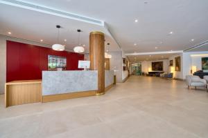 a lobby of a hotel with a reception desk at Hotel Ybarra Sevilla in Seville +185 photos
