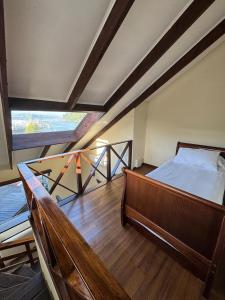 a bedroom with a bed and a balcony at Cabañas del Puerto in Puerto Montt