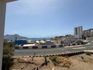 a view of a street with a city and the ocean at Miles Dreams Laginha in Mindelo