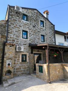 a large stone building with a large doorway at Vila EVANA in Sečovlje