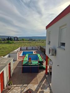 a view of a swimming pool from a building at Neiras Apartments Blagaj in Blagaj