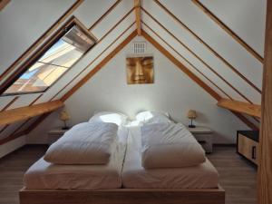 a bedroom with a bed with a gold mask on the ceiling at Port Griad in De Haan