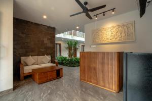 a living room with a couch and a table at Miles Coliving Bali, close to Seminyak and Canggu in Kerobokan